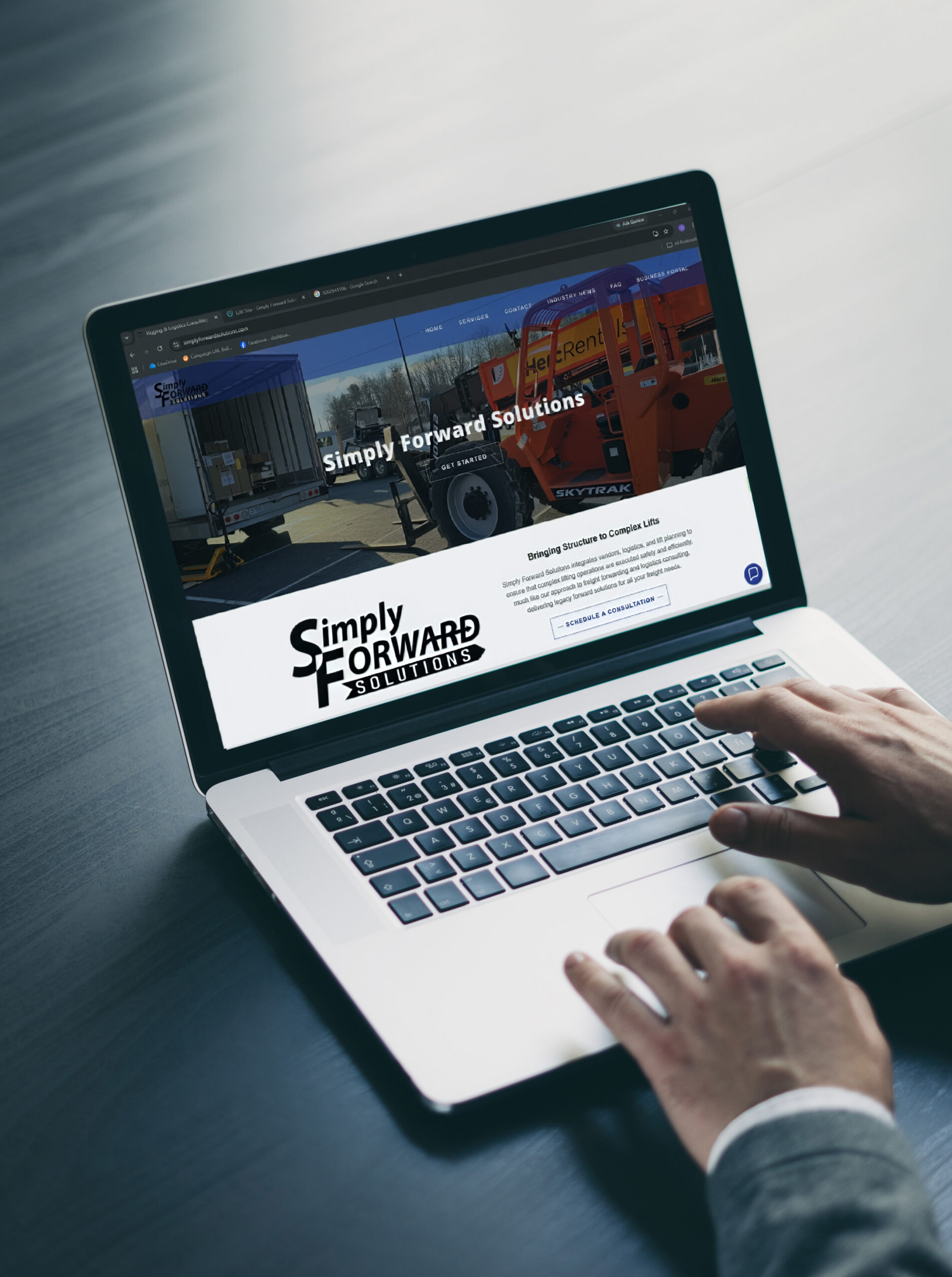 SFS---image-on-screen-tall Business professional using a laptoip to browse the simplyforwardsolutions.com website.